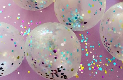 Photo of transparent balloons filled with confetti